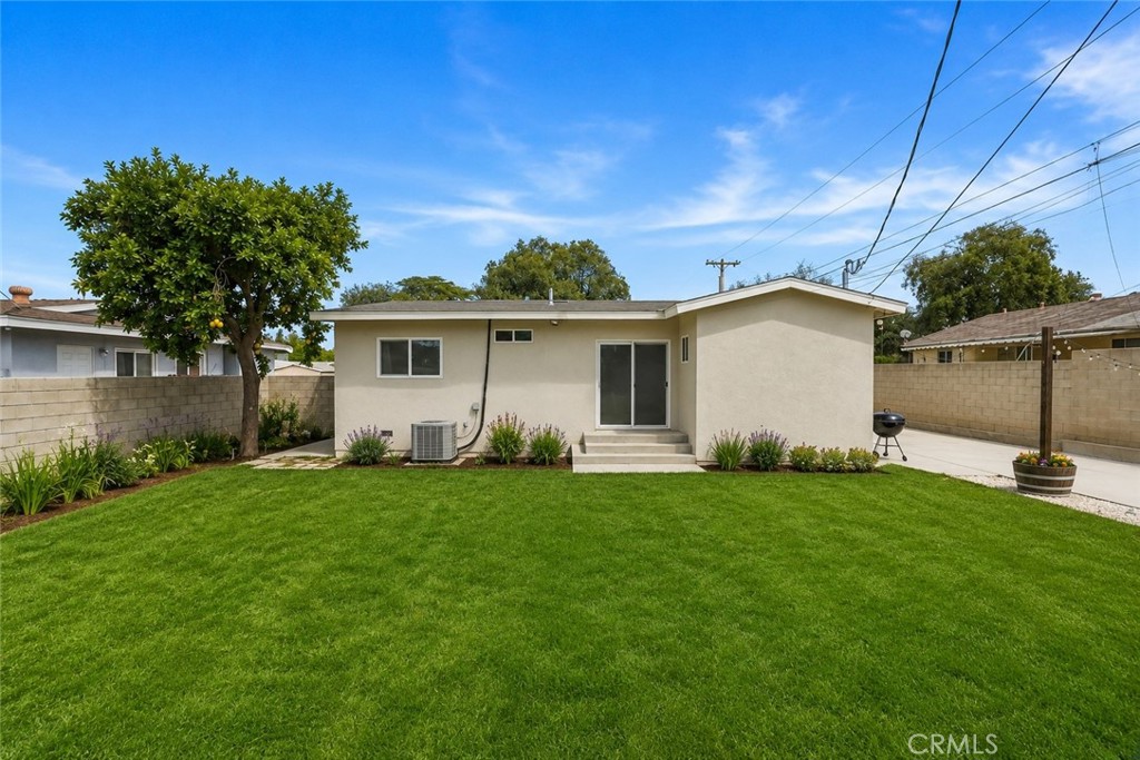 10028 Primrose Drive Riverside, CA 92503 - Photo 15 of 19 a view of a house with a backyard