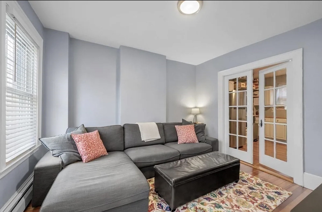 80 Park Street, Unit A Chelsea, MA 02150 - Photo 1 of 11 a living room with furniture and a window
