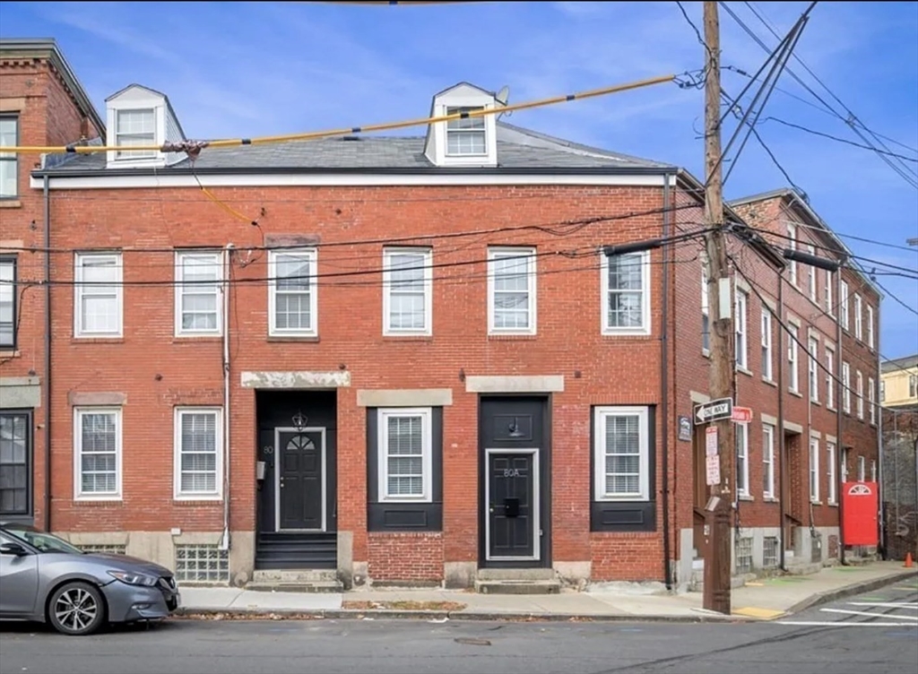 80 Park Street, Unit A Chelsea, MA 02150 - Photo 11 of 11 a front view of a building with a parking space