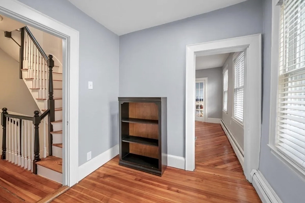 80 Park Street, Unit A Chelsea, MA 02150 - Photo 4 of 11 a view of a hallway with wooden floor and windows