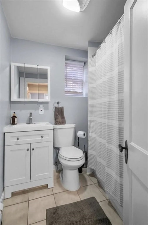 80 Park Street, Unit A Chelsea, MA 02150 - Photo 9 of 11 a bathroom with a sink toilet vanity and shower