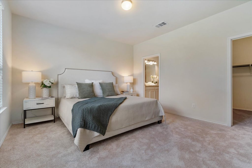 404 Sierra Mar Loop Leander, TX 78641 - Photo 14 of 30 Primary suite has a huge walk in closet.