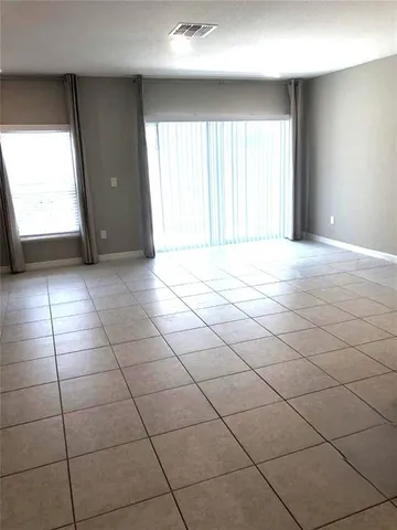 a kitchen with a sink stove and microwave