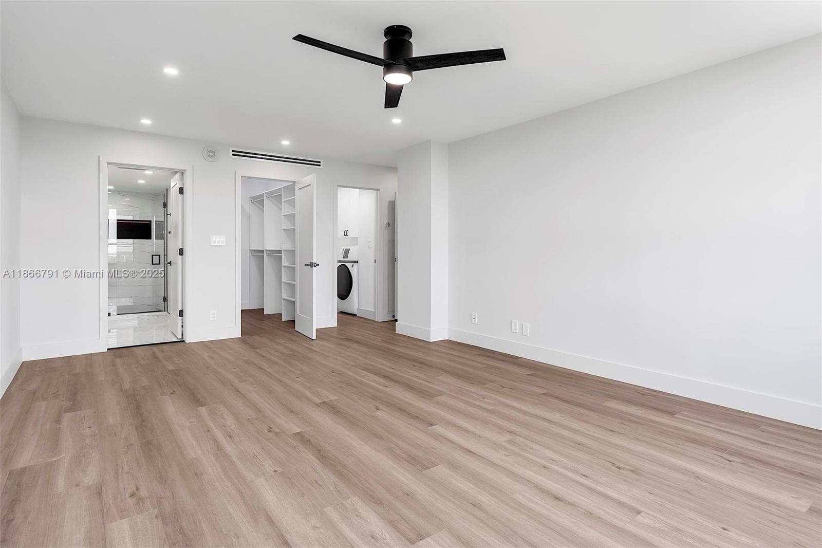 780 Northeast 69th Street, Unit 910 Miami, FL 33138 - Photo 12 of 26 a view of empty room with wooden floor