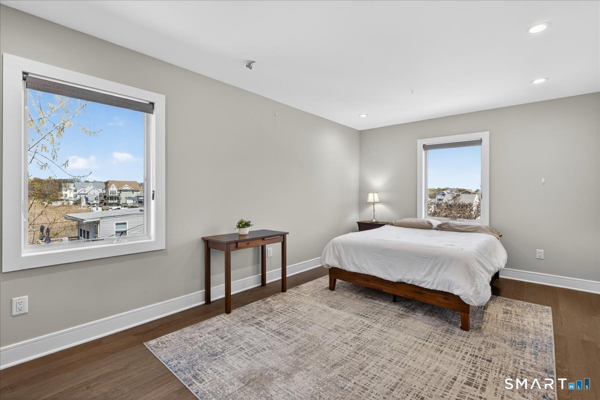 33 Pearl Street Milford, CT 06460 - Photo 24 of 40 a bedroom with a bed and a window