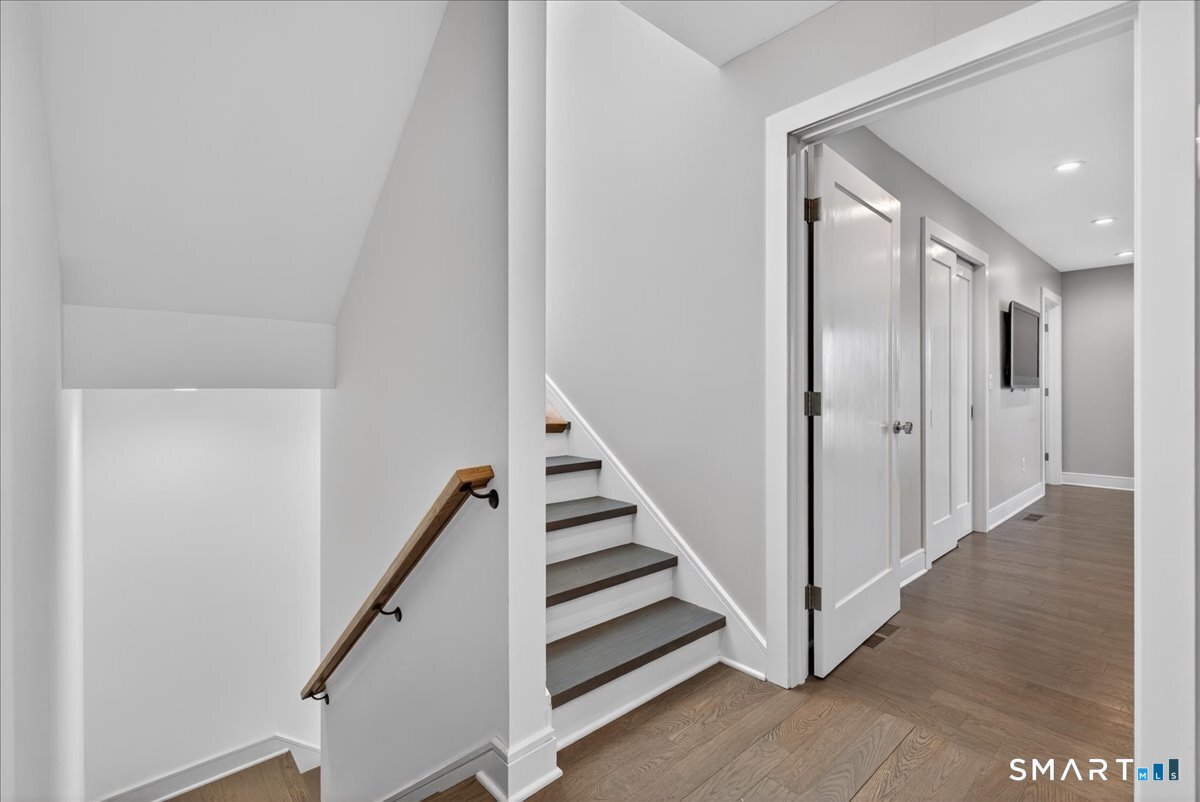 33 Pearl Street Milford, CT 06460 - Photo 31 of 40 a view of a hallway with staircase