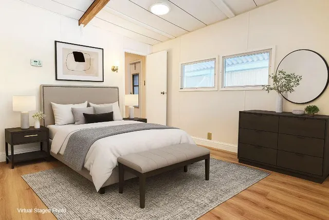 a bedroom with a bed and a dresser