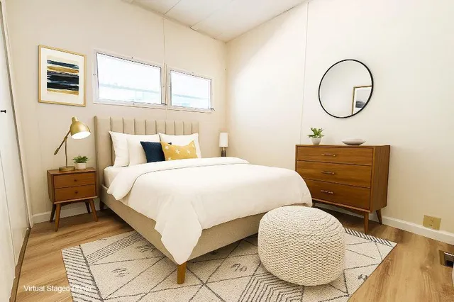 a bedroom with a bed and a dresser