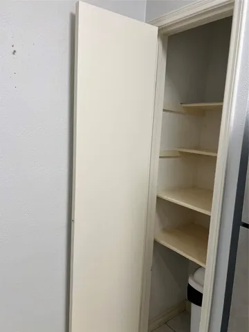 a view of an empty walk in closet