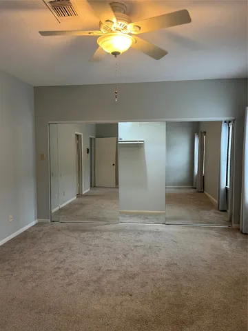 a bathroom with a sink double vanity and a mirror