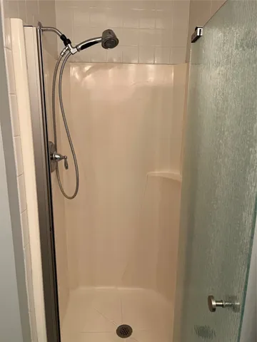 a bathroom with a tub and a shower