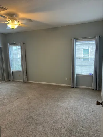 a view of an empty room and a window