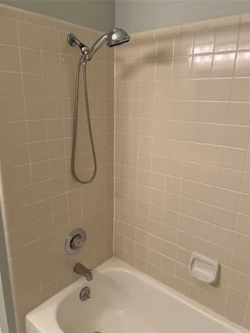 a close up of a bathtub in a bathroom