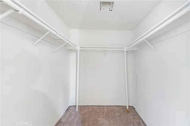 a spacious bathroom with a double vanity sink and a mirror
