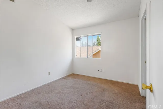 a bathroom with a granite countertop toilet and a shower
