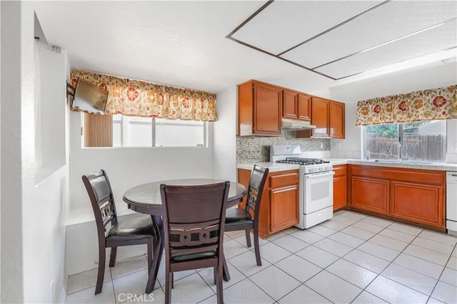 a kitchen with a sink cabinets and window
