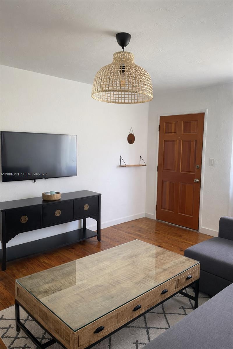 5800 Southwest 61st Street Miami, FL 33143 - Photo 16 of 23 a room with furniture and a flat screen tv