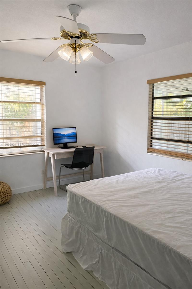 5800 Southwest 61st Street Miami, FL 33143 - Photo 7 of 23 a bedroom with a bed and a window