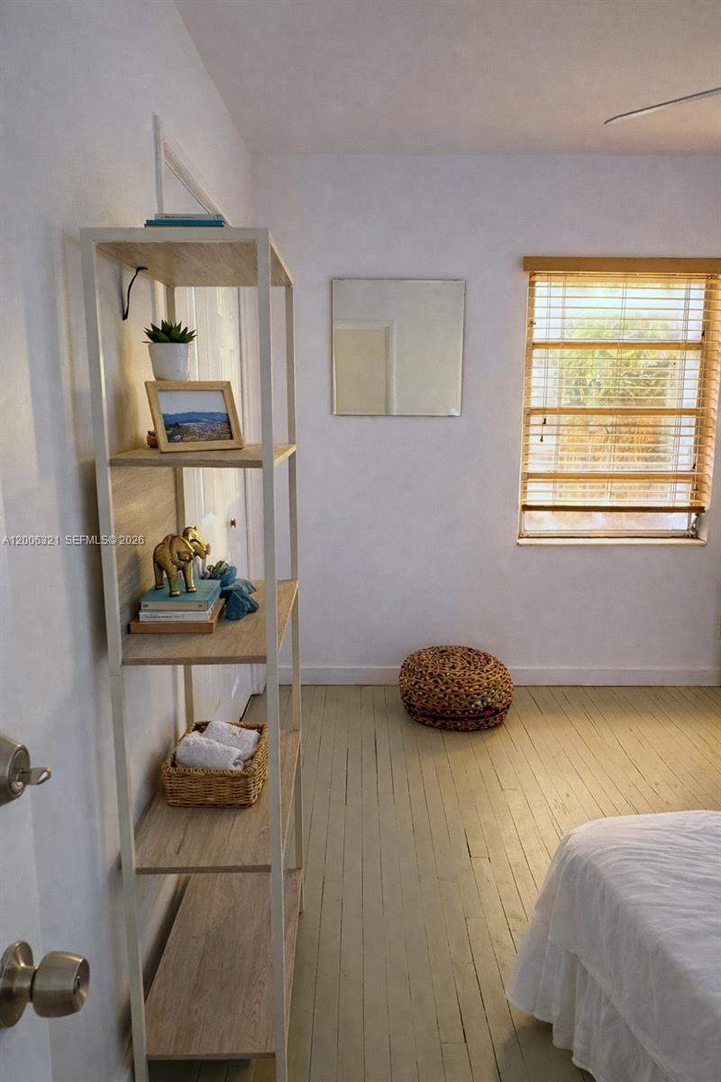 5800 Southwest 61st Street Miami, FL 33143 - Photo 8 of 23 a bedroom with a bed and a window