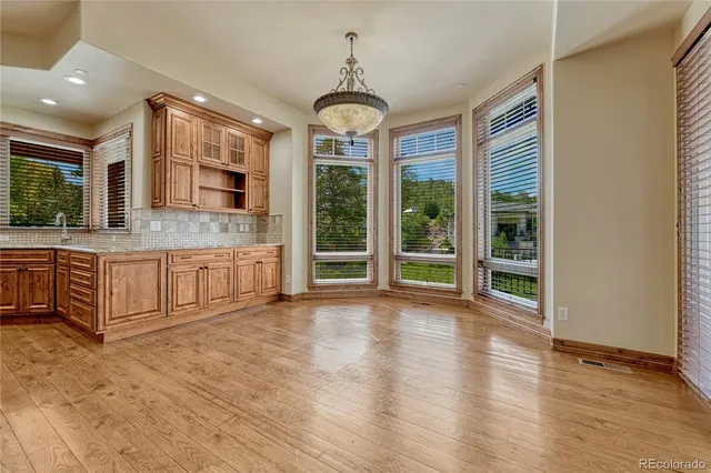 a view of a livingroom with a ceiling fan and window