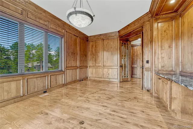 a view of an empty room with a fireplace