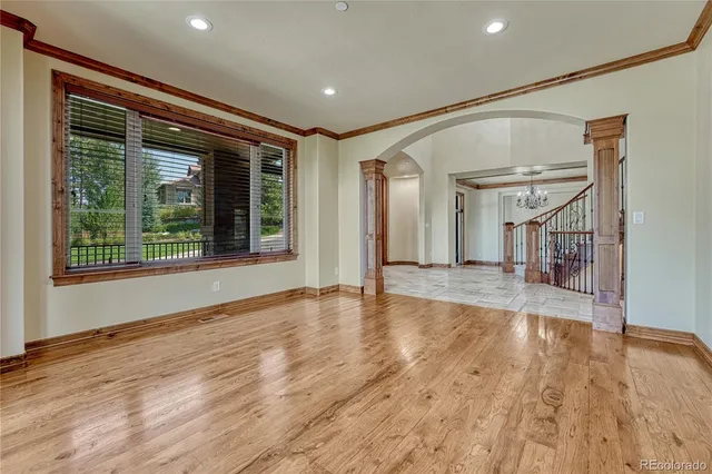a kitchen with granite countertop white cabinets and a sink