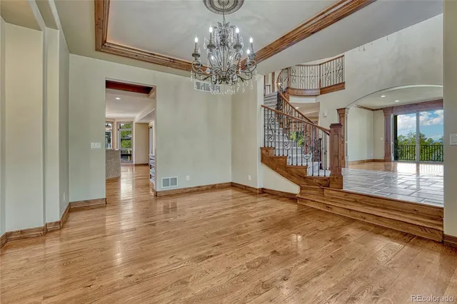 a view of a room with a large windows and wooden floor
