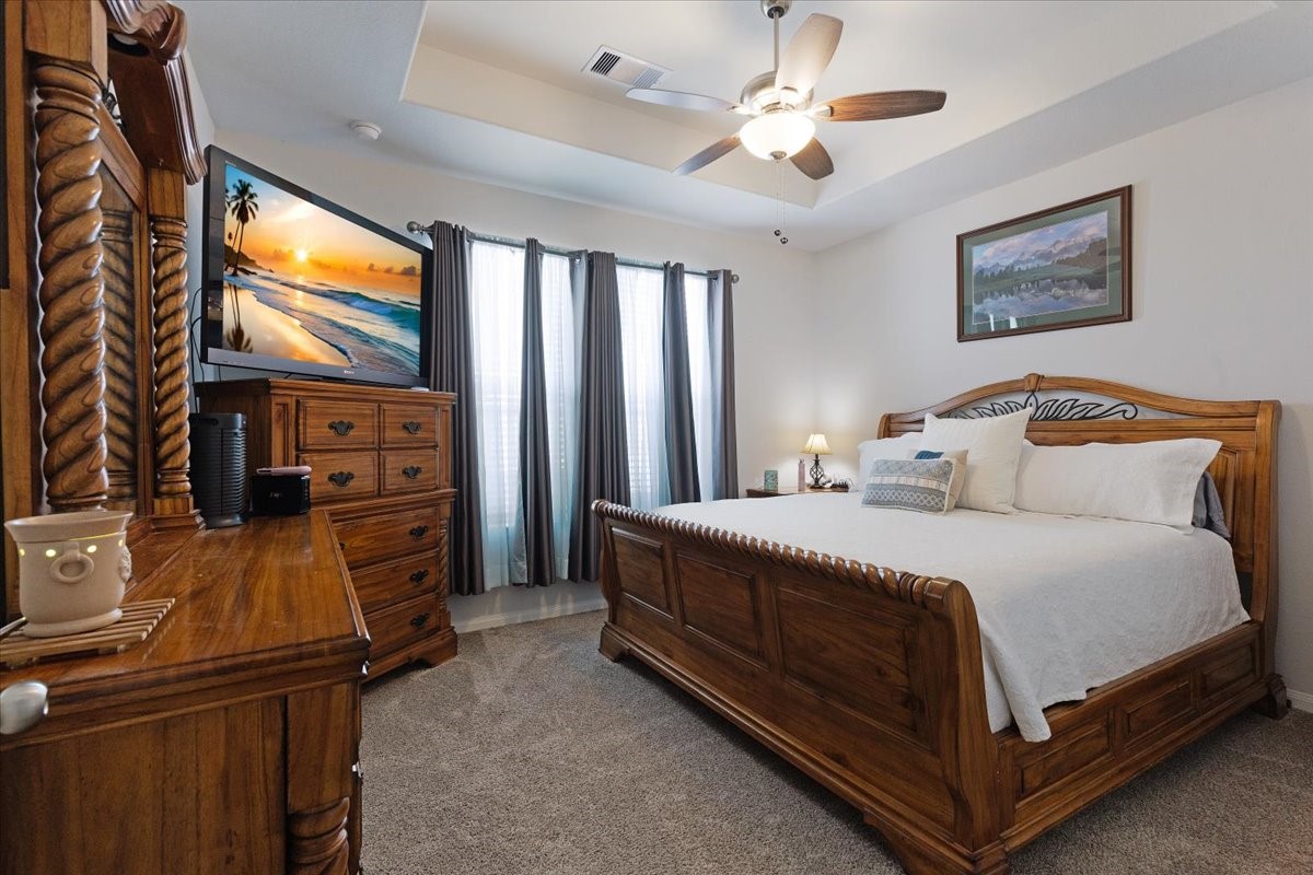 1685 County Road 5102 East Cleveland, TX 77327 - Photo 12 of 31 a bedroom with a bed and a flat screen tv