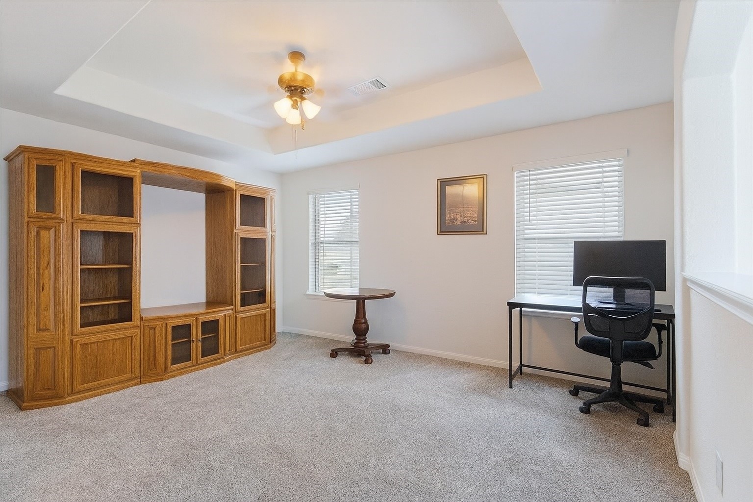 1685 County Road 5102 East Cleveland, TX 77327 - Photo 17 of 31 a view of a livingroom with workspace and a window