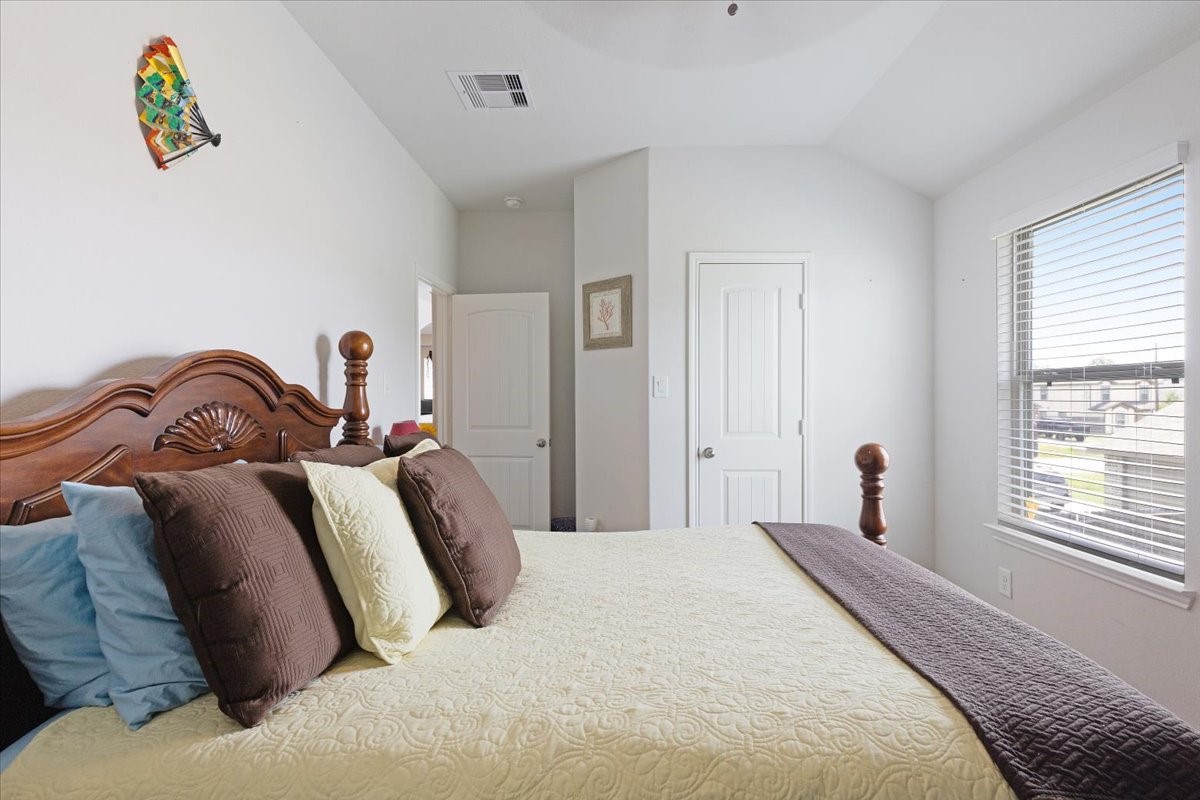 1685 County Road 5102 East Cleveland, TX 77327 - Photo 20 of 31 a bedroom with a bed and a window