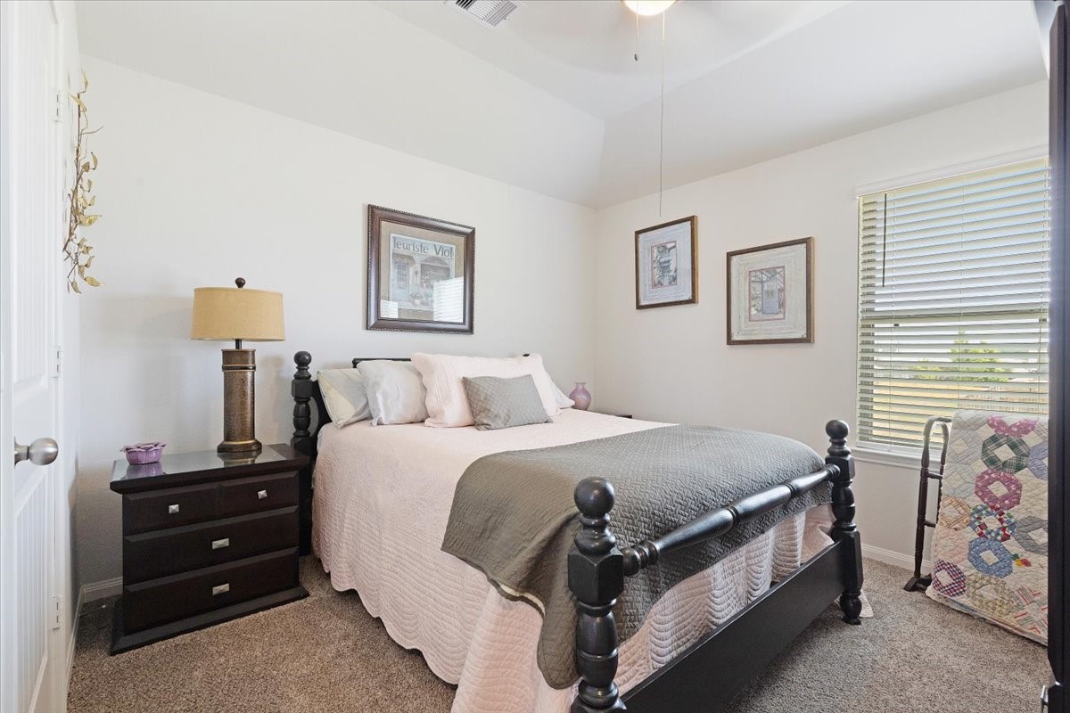 1685 County Road 5102 East Cleveland, TX 77327 - Photo 22 of 31 a spacious bedroom with a bed and a window