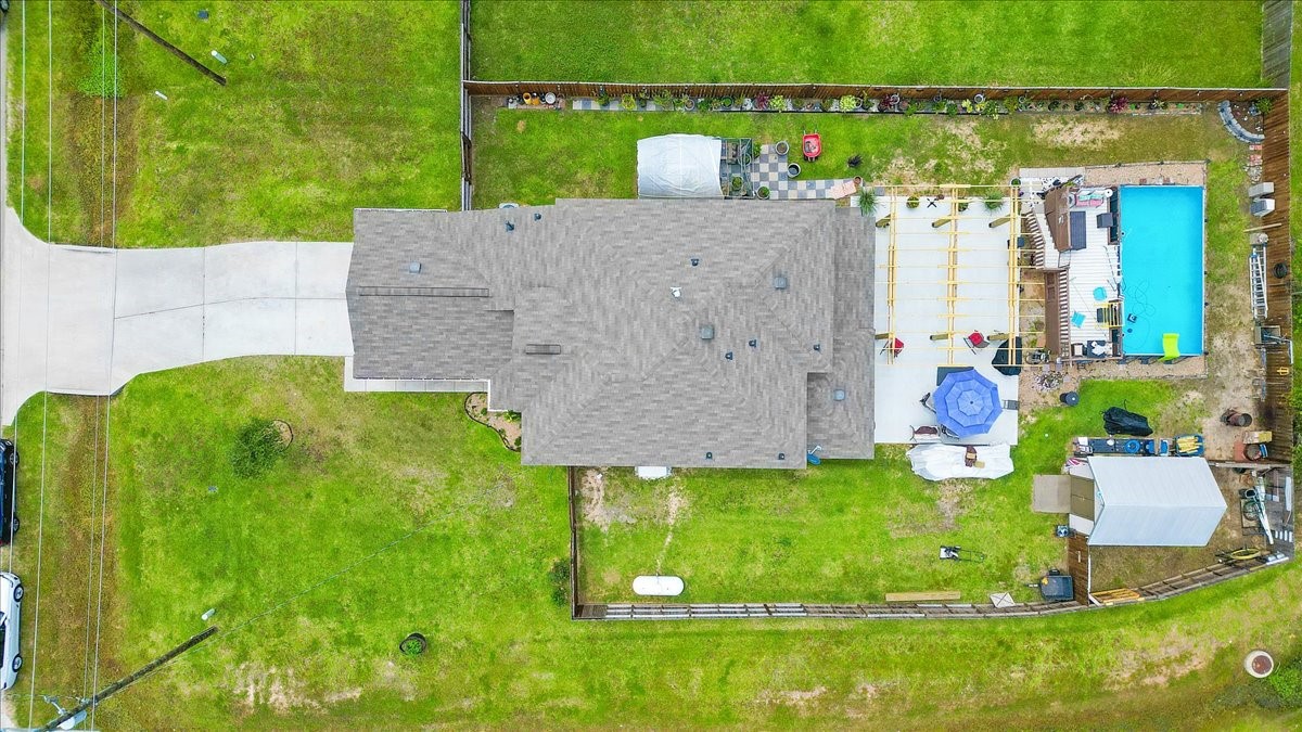 1685 County Road 5102 East Cleveland, TX 77327 - Photo 27 of 31 swimming pool with outdoor seating