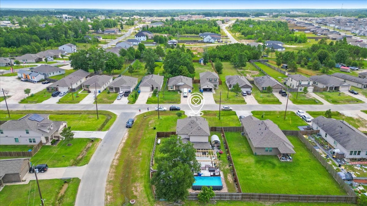 1685 County Road 5102 East Cleveland, TX 77327 - Photo 28 of 31 an aerial view of residential houses with outdoor space