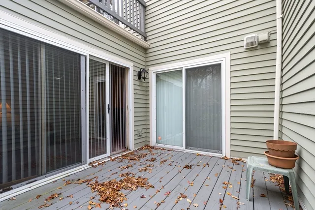 a view of a patio with chair and tables