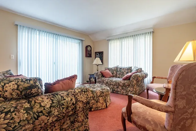 a bed room with two bed and a couch