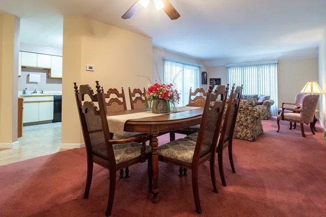 a dining room with furniture and window