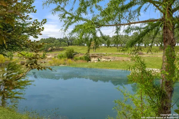 a view of a lake with a big yard