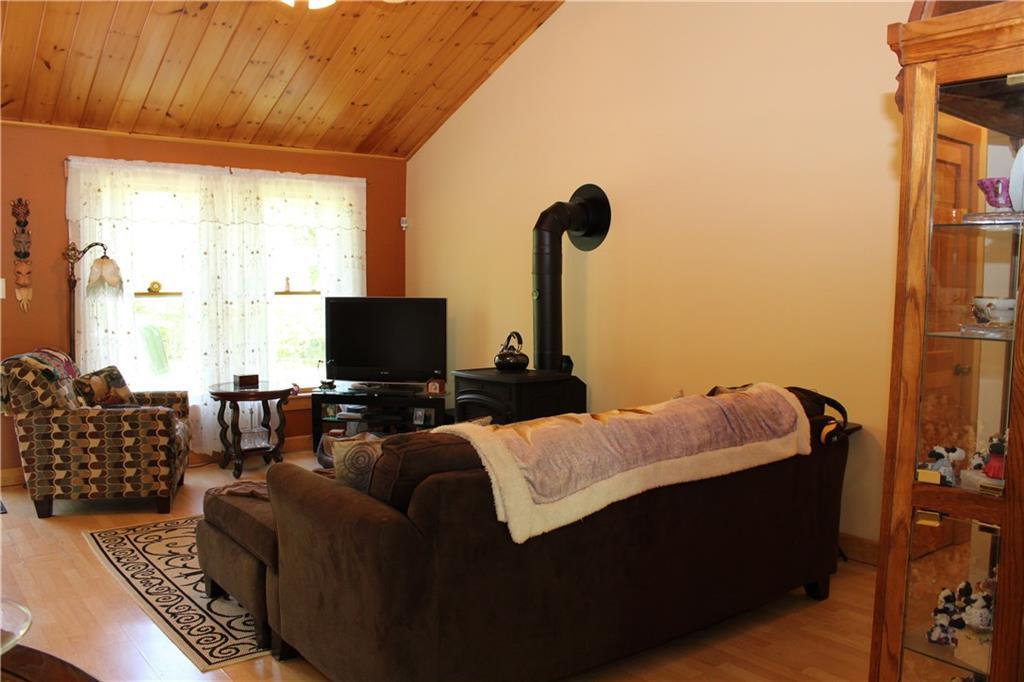611 Borough Road Chesterville, ME 04938 - Photo 14 of 35 Newer wood stove in living room for...