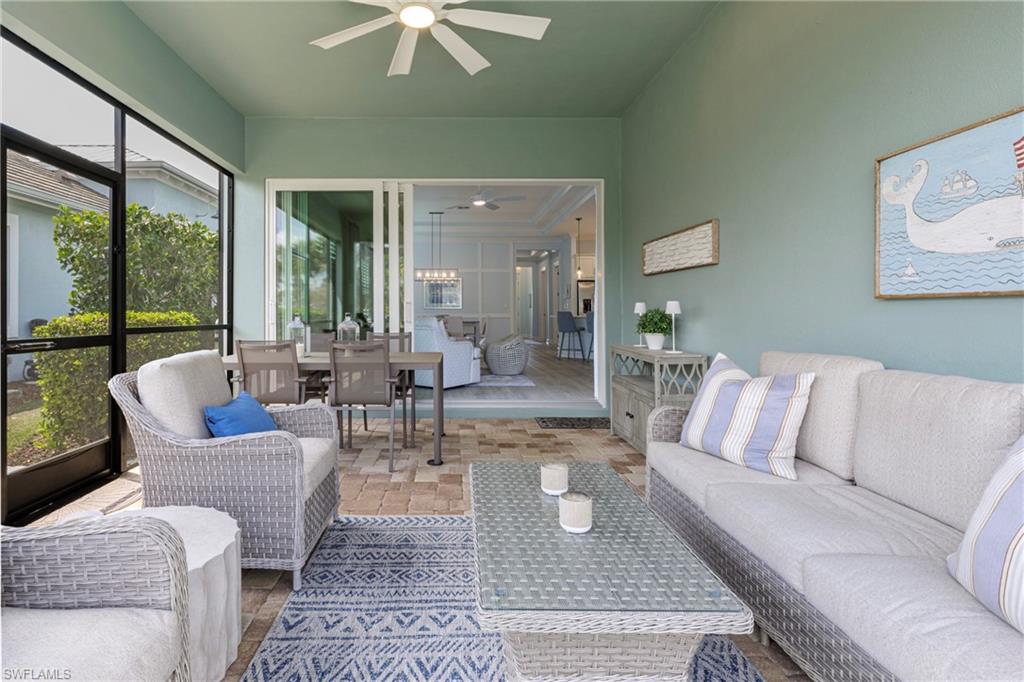 5906 Haiti Drive Naples, FL 34113 - Photo 11 of 44 a living room with furniture and a large window