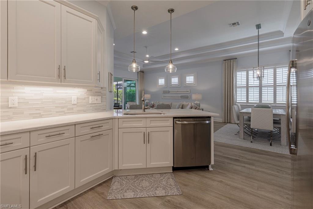 5906 Haiti Drive Naples, FL 34113 - Photo 15 of 44 a kitchen with a sink cabinets and window