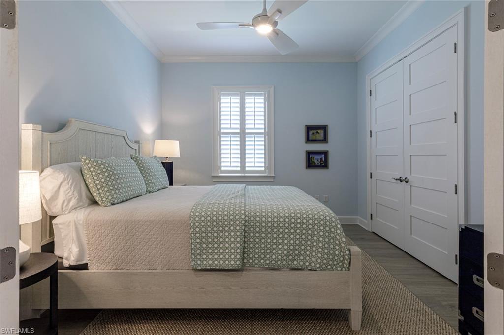 5906 Haiti Drive Naples, FL 34113 - Photo 21 of 44 a bedroom with a bed and window