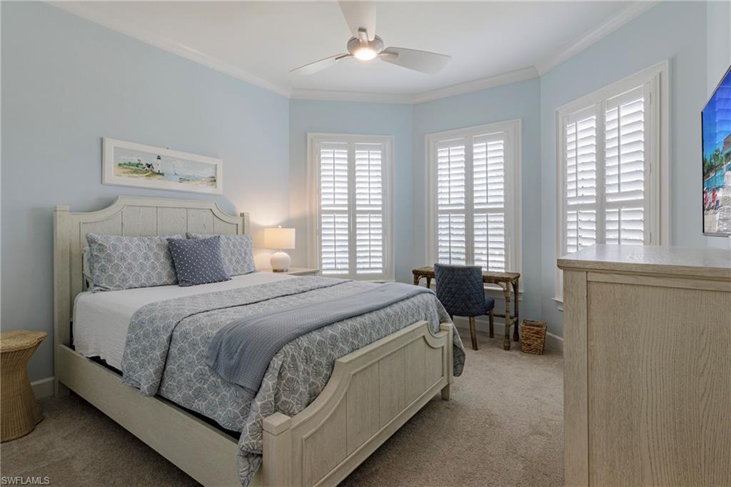 5906 Haiti Drive Naples, FL 34113 - Photo 23 of 44 a bed room with a bed and chairs