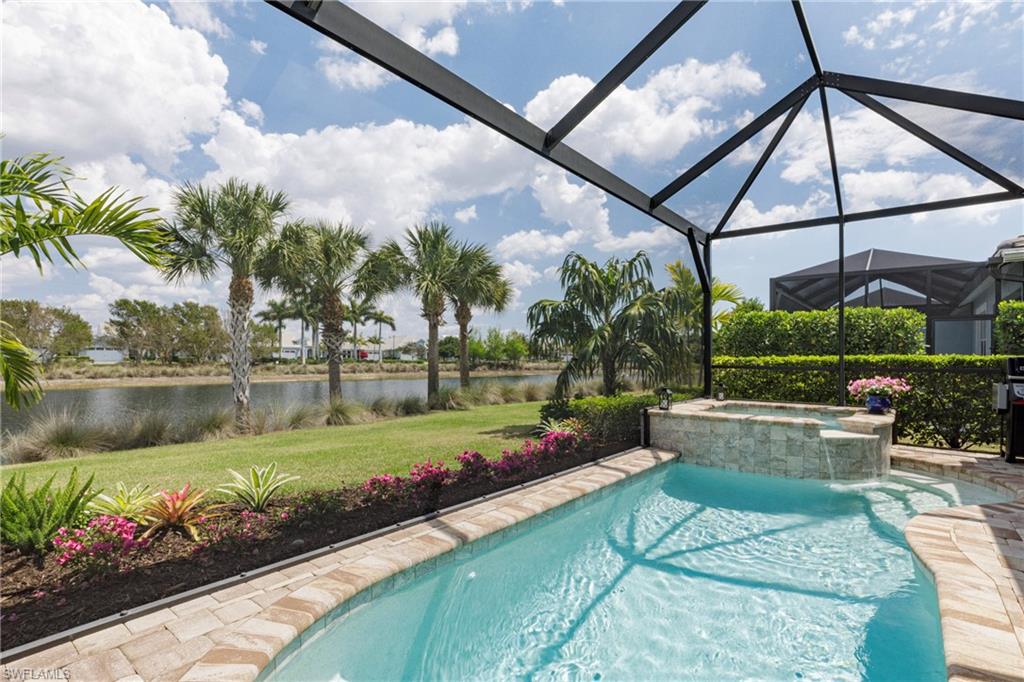 5906 Haiti Drive Naples, FL 34113 - Photo 8 of 44 a view of a swimming pool with a patio