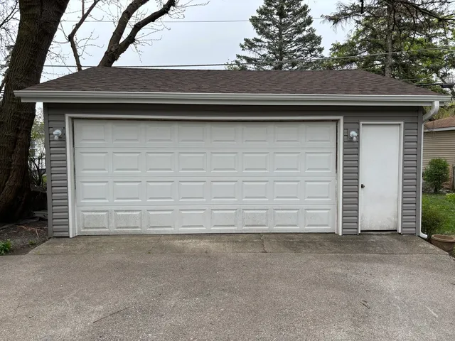a view of a house with a snow on the road
