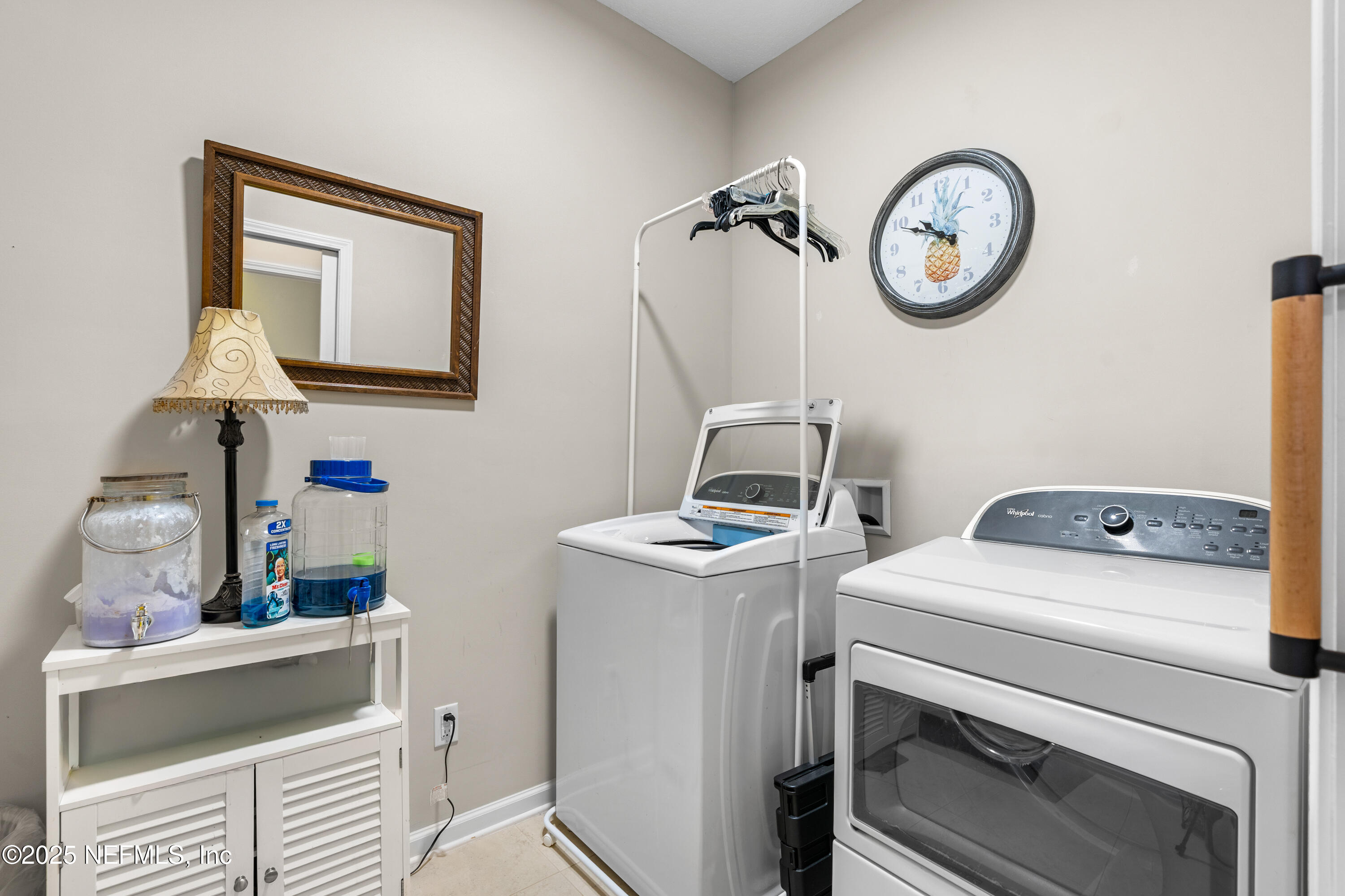 3165 Chestnut Ridge Way Orange Park, FL 32065 - Photo 16 of 35 a view of storage and utility room with washer and dryer