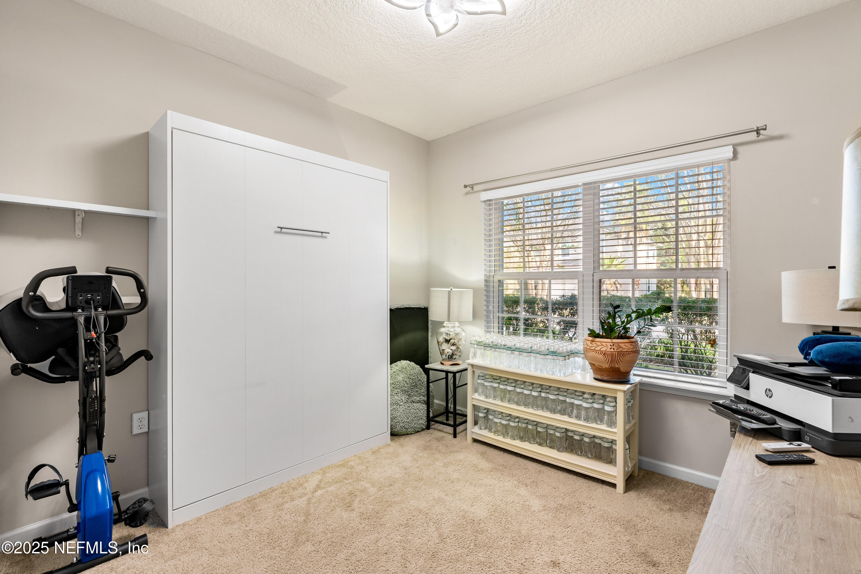 3165 Chestnut Ridge Way Orange Park, FL 32065 - Photo 17 of 35 a bedroom with furniture and a window