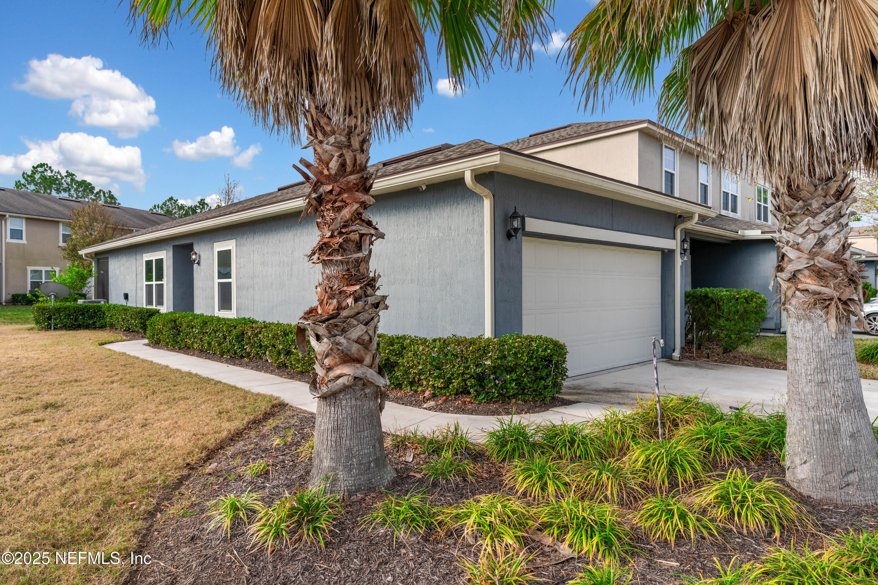 3165 Chestnut Ridge Way Orange Park, FL 32065 - Photo 2 of 35 a front view of house with yard and green space