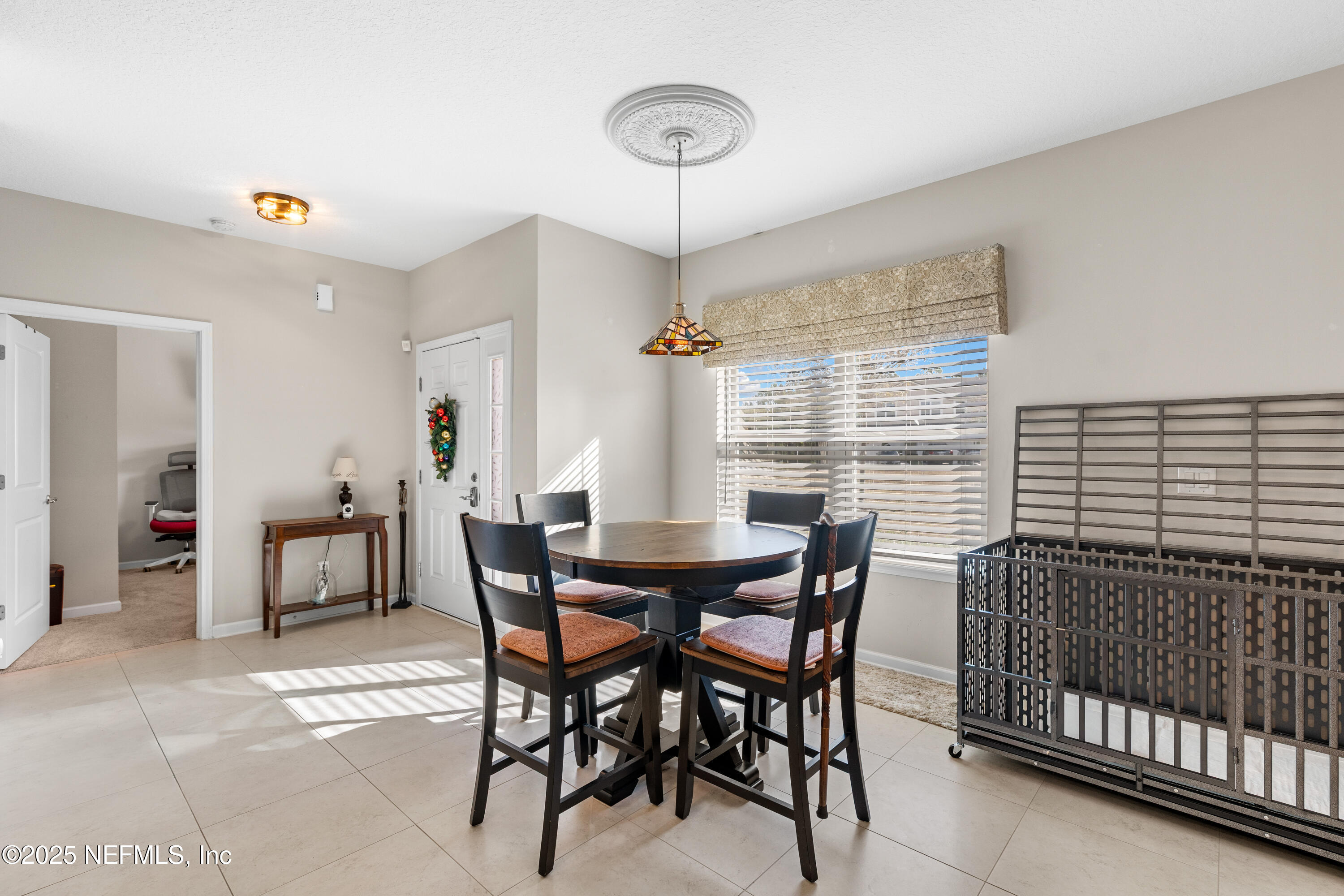 3165 Chestnut Ridge Way Orange Park, FL 32065 - Photo 22 of 35 a view of a dining room with furniture
