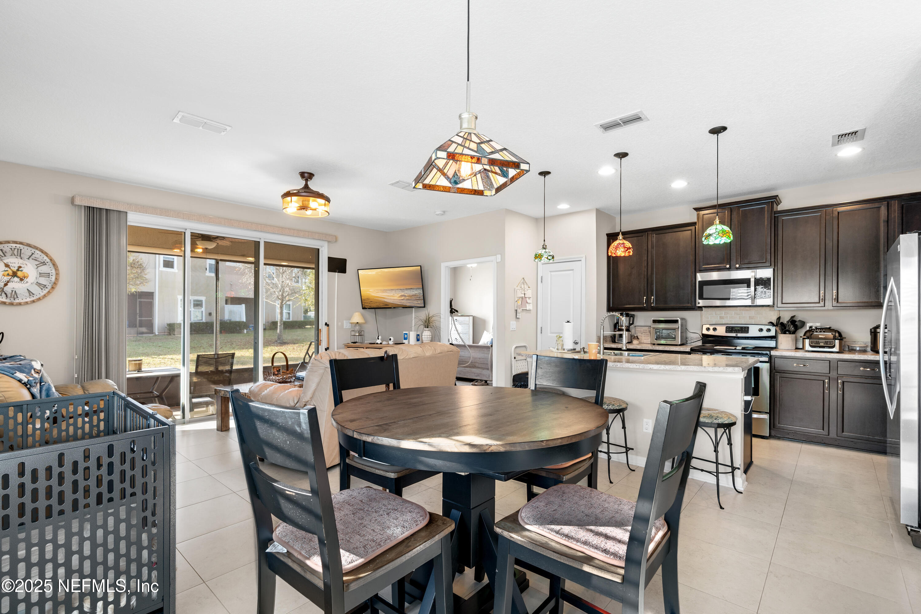 3165 Chestnut Ridge Way Orange Park, FL 32065 - Photo 23 of 35 a view of a dining room with furniture window and outside view