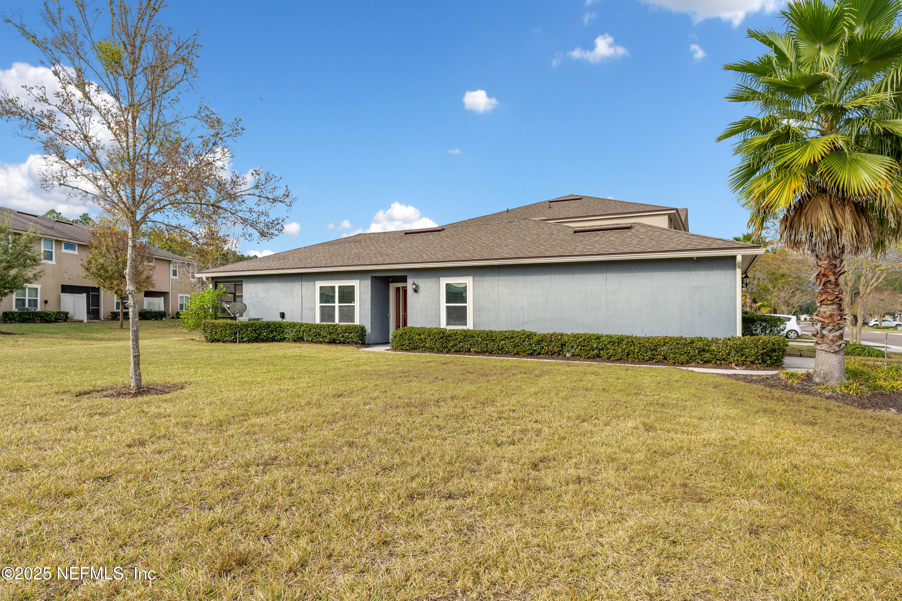 3165 Chestnut Ridge Way Orange Park, FL 32065 - Photo 24 of 35 a front view of a house with a garden